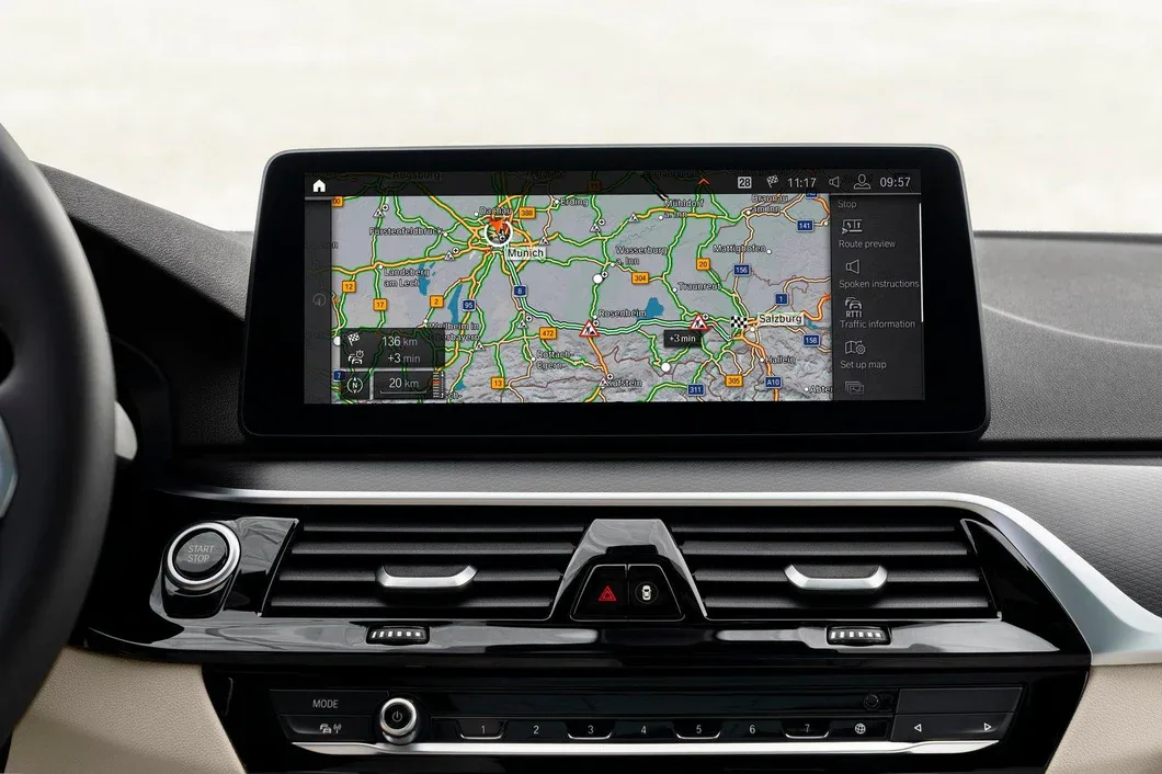 BMW iDrive screen displaying a navigation map of the Munich and Salzburg region — the result of a current BMW map update.